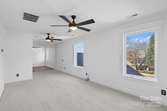 unfurnished living room featuring light carpet