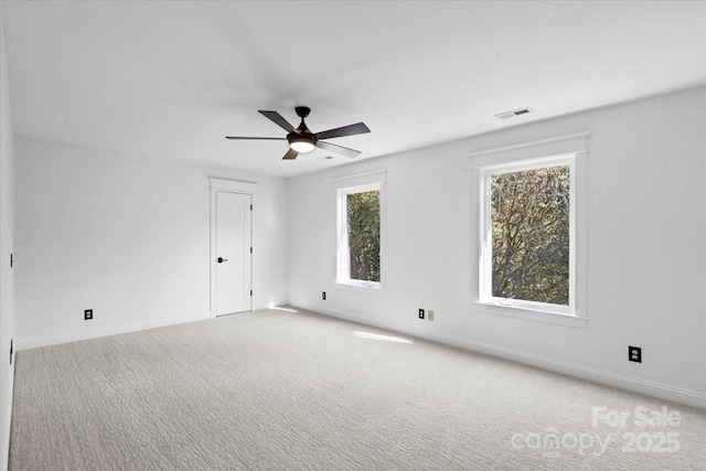 unfurnished room with carpet flooring and ceiling fan