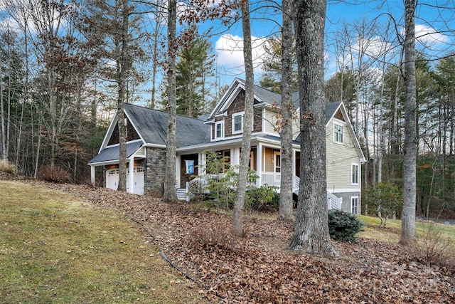 view of front of home featuring a garage and covered porch