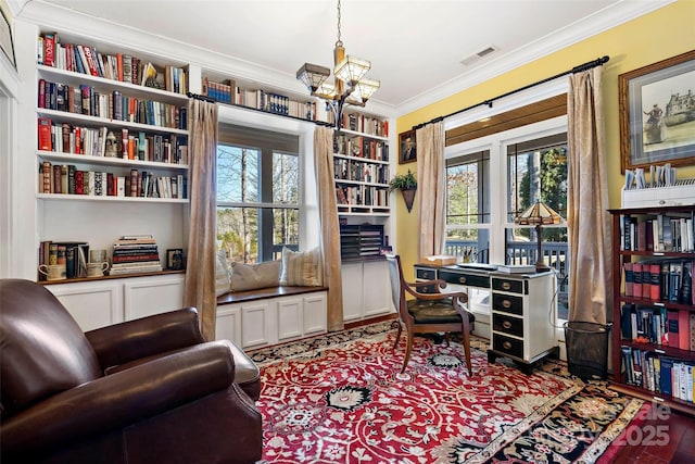 office area with a healthy amount of sunlight, an inviting chandelier, visible vents, and ornamental molding