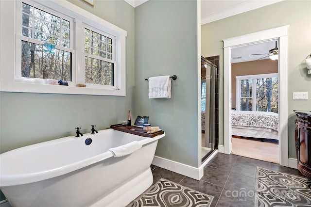 full bathroom with baseboards, connected bathroom, tile patterned floors, crown molding, and a freestanding bath