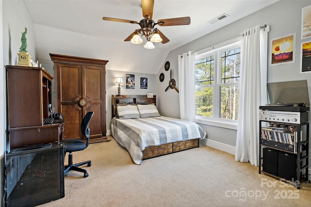 bedroom featuring lofted ceiling, light colored carpet, visible vents, a ceiling fan, and baseboards