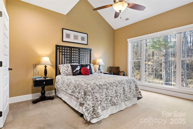 carpeted bedroom with vaulted ceiling, ceiling fan, visible vents, and baseboards