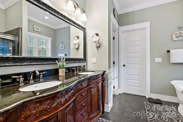 full bathroom featuring double vanity, crown molding, and a sink