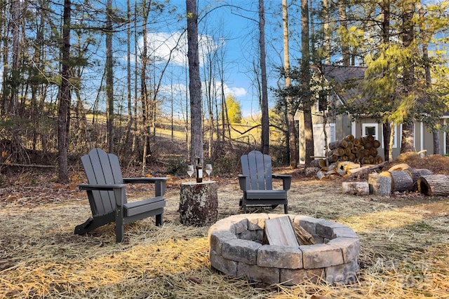 view of yard with a fire pit