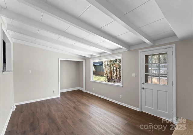 interior space with vaulted ceiling with beams and dark hardwood / wood-style floors