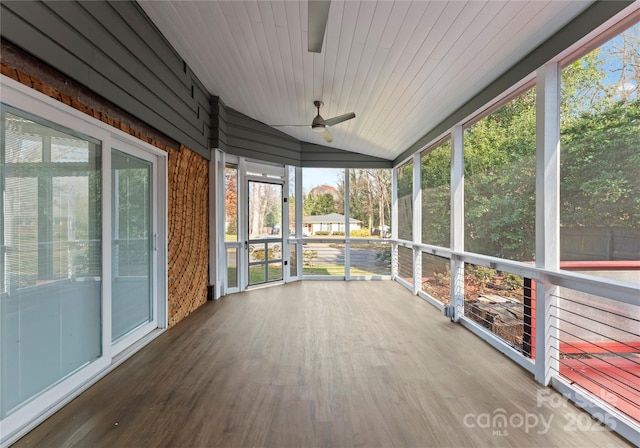 unfurnished sunroom featuring lofted ceiling