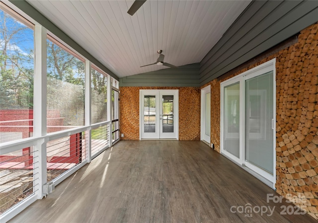 unfurnished sunroom with lofted ceiling, ceiling fan, and wood ceiling