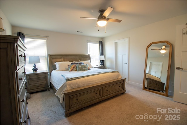 carpeted bedroom with ceiling fan