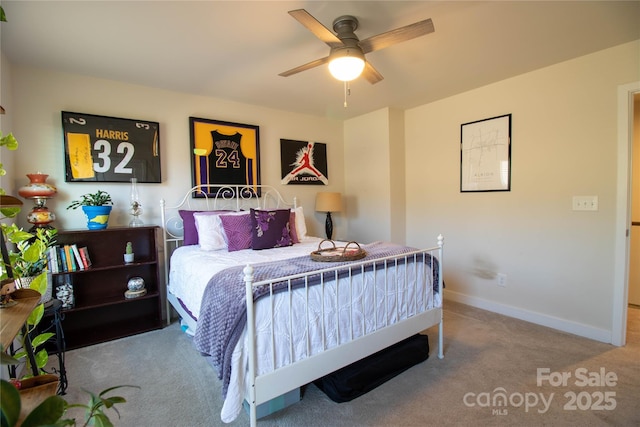 bedroom featuring light colored carpet and ceiling fan