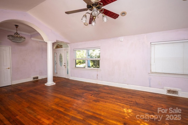 interior space with dark hardwood / wood-style flooring, ornate columns, ceiling fan, crown molding, and lofted ceiling