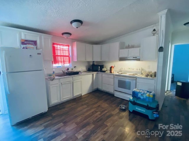 kitchen with white appliances, white cabinets, sink, vaulted ceiling, and dark hardwood / wood-style flooring