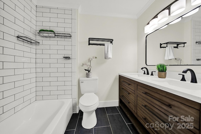 full bathroom with ornamental molding, vanity, toilet, and tiled shower / bath combo