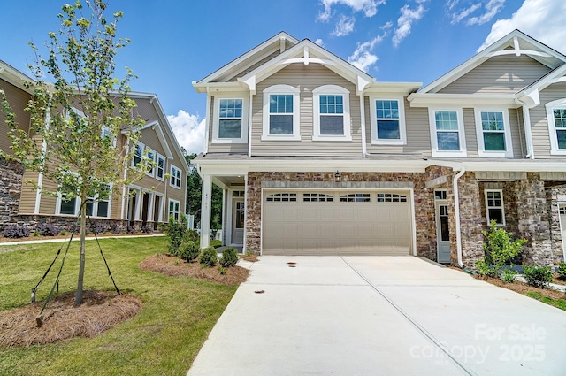 view of front of home featuring a garage and a front yard