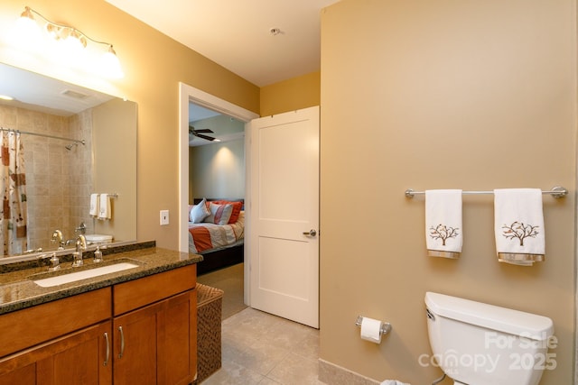 bathroom featuring vanity, tile patterned floors, ceiling fan, toilet, and curtained shower