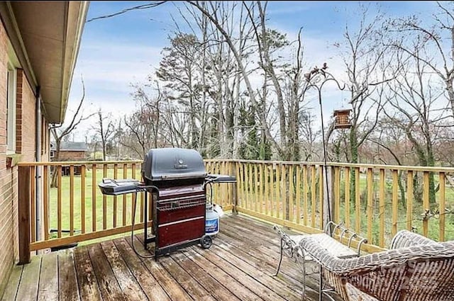 wooden deck with area for grilling