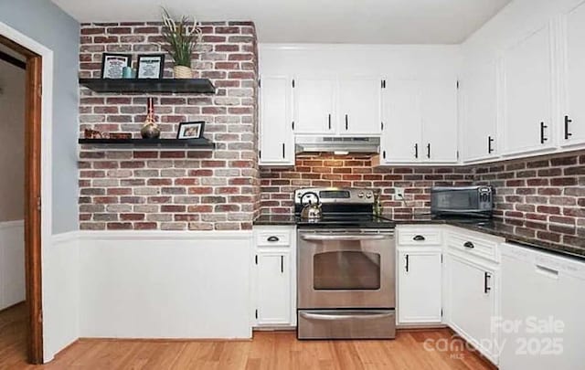 kitchen with white cabinets, white dishwasher, stainless steel range with electric stovetop, and light wood-type flooring