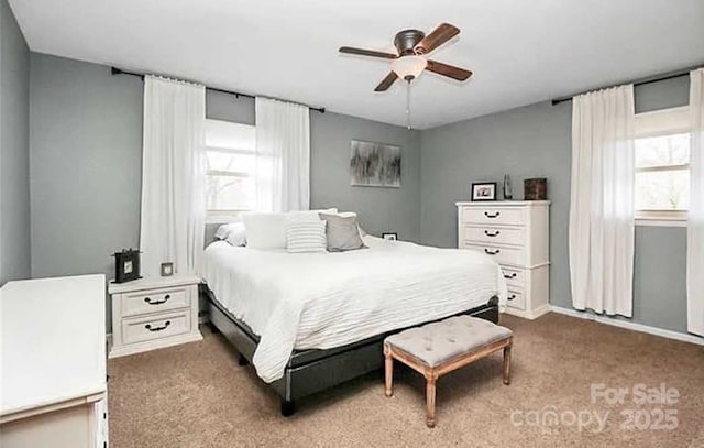 bedroom with dark carpet and ceiling fan