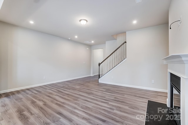 unfurnished living room featuring light hardwood / wood-style flooring