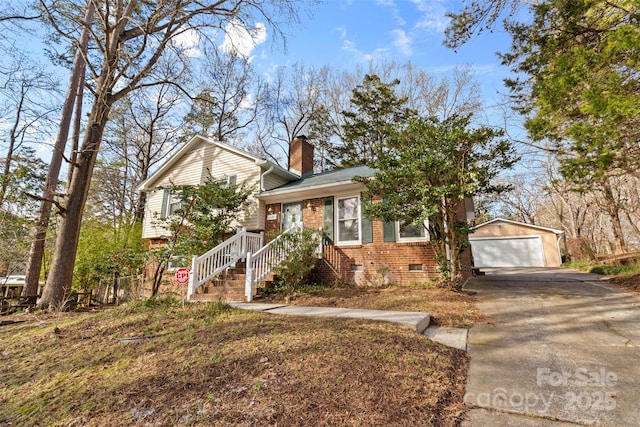 view of front of house featuring an outbuilding and a garage