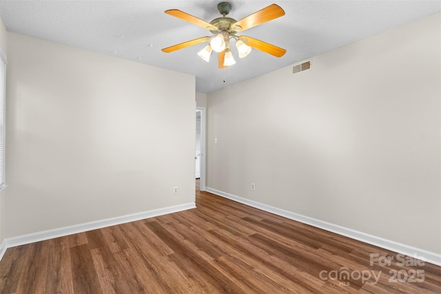 empty room featuring hardwood / wood-style floors and ceiling fan