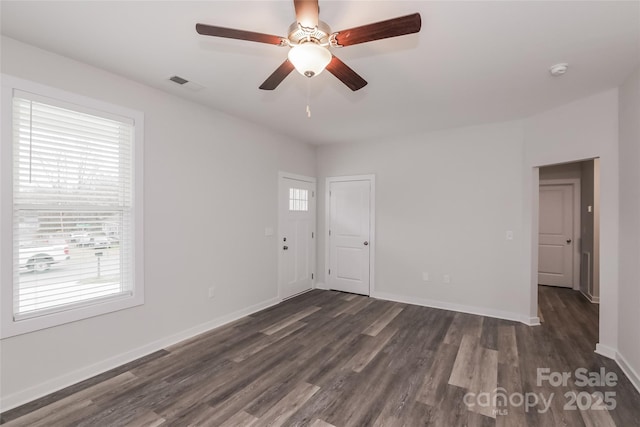 empty room featuring ceiling fan and dark hardwood / wood-style floors