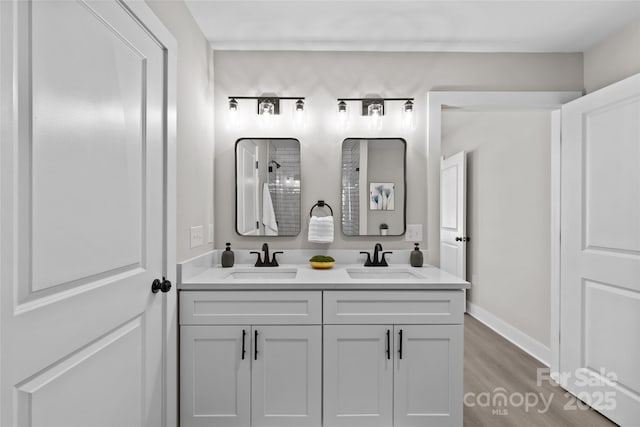 bathroom with vanity and hardwood / wood-style floors