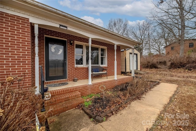 property entrance with covered porch