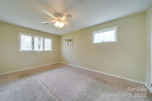 unfurnished room featuring carpet floors and ceiling fan