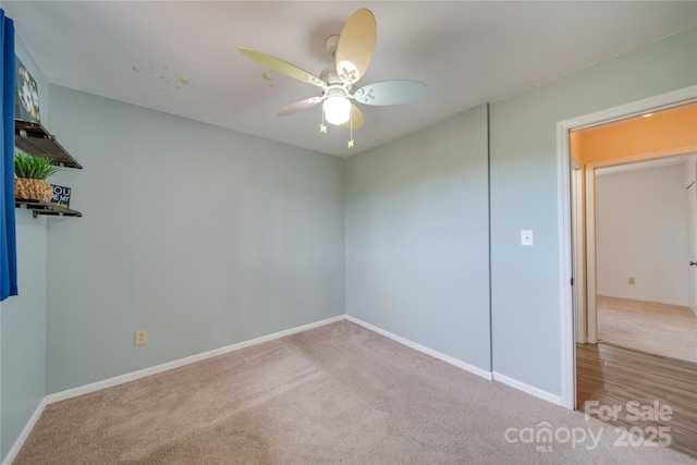 unfurnished bedroom with ceiling fan and light carpet