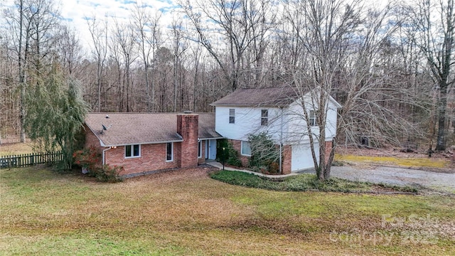 view of property exterior with a yard and a garage