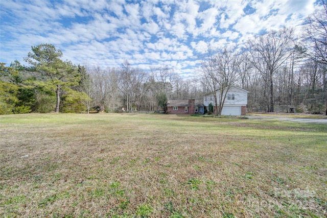 view of yard featuring a garage