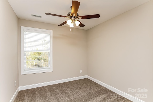 spare room with ceiling fan and carpet floors