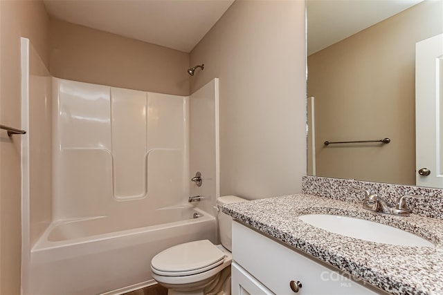 full bathroom featuring toilet, vanity, and bathing tub / shower combination