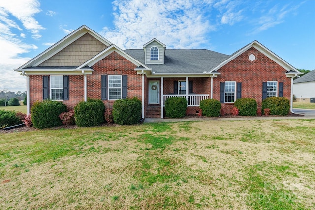 view of front of property with a front lawn and covered porch