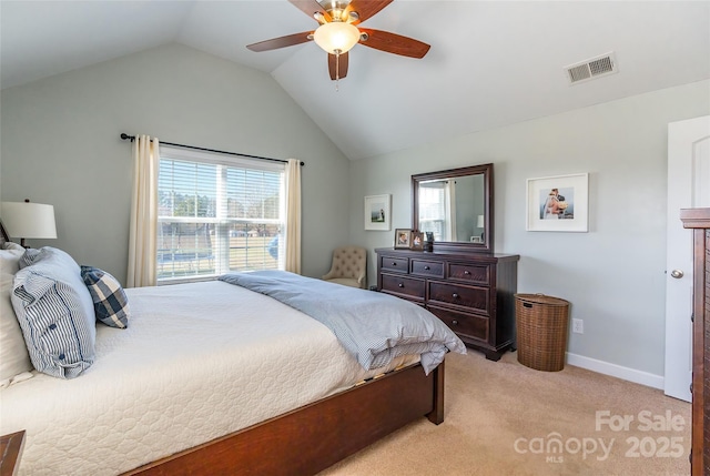 bedroom with light colored carpet, ceiling fan, and lofted ceiling