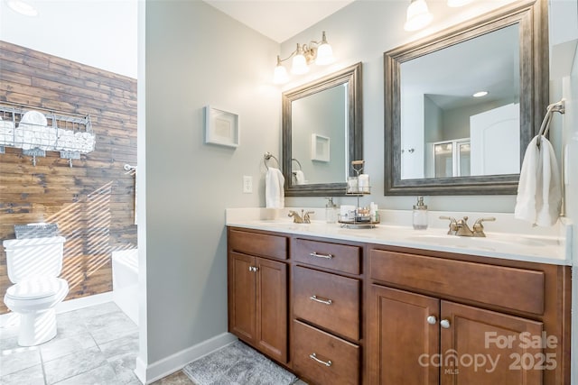 bathroom with a bathing tub, tile patterned flooring, wood walls, toilet, and vanity