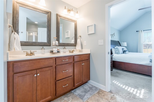 bathroom with walk in shower, vanity, vaulted ceiling, and ceiling fan