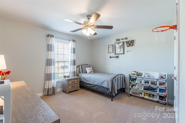 bedroom featuring ceiling fan and light carpet