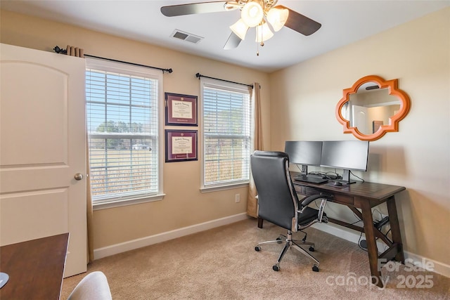 carpeted home office with ceiling fan