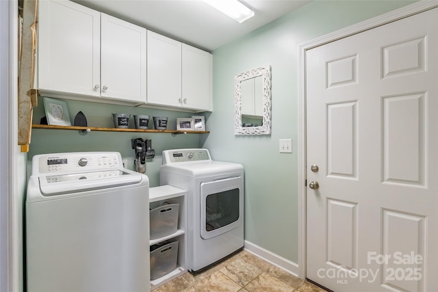 washroom with light tile patterned flooring, cabinets, and separate washer and dryer