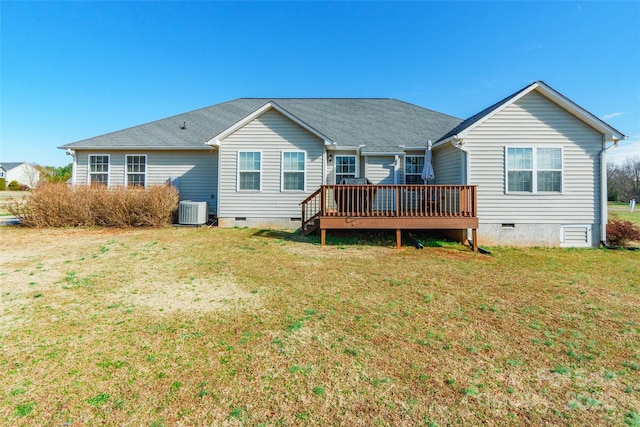 back of house featuring a lawn, central AC, and a deck