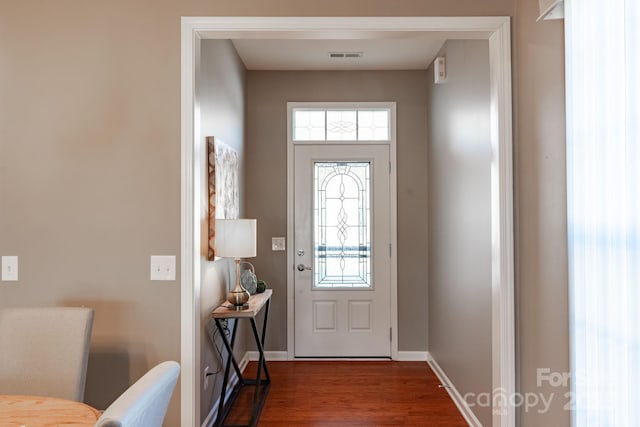 doorway with dark hardwood / wood-style floors