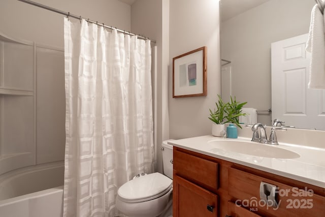 full bathroom with vanity, toilet, and shower / bath combo with shower curtain