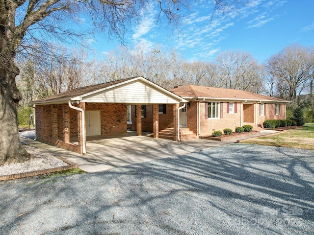 ranch-style house with a carport