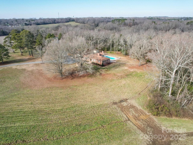 birds eye view of property featuring a rural view