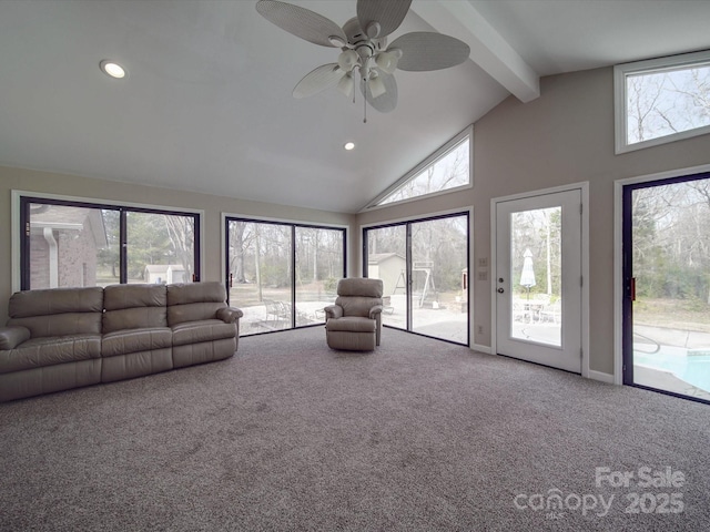 unfurnished living room featuring beam ceiling, ceiling fan, and carpet flooring