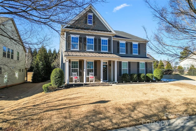 view of front of home featuring a front lawn and a porch