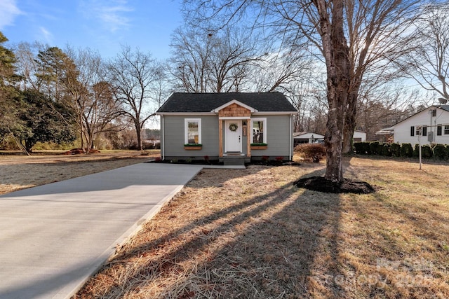 bungalow with a front yard