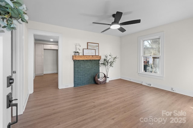 living room with ceiling fan and hardwood / wood-style floors